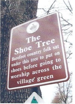 Historical Shoe Tree Marker sign: Barefoot country folk sat under this tree to put on shoes before going to worship across the village green.